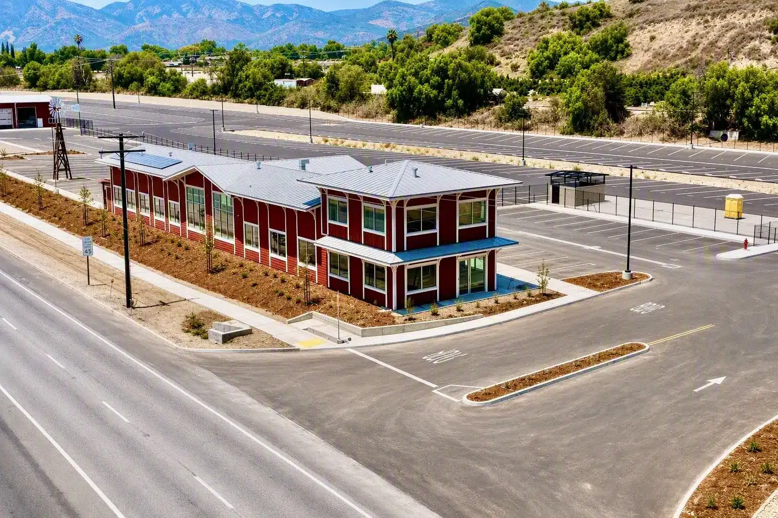 Aerial of the Highway 126 RV office, solar roof and rows of fenced RV storage spaces along Highway 126 in Fillmore, CA